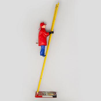 A tinplate Marx toys "The Climbing Fireman", 1950/60s.