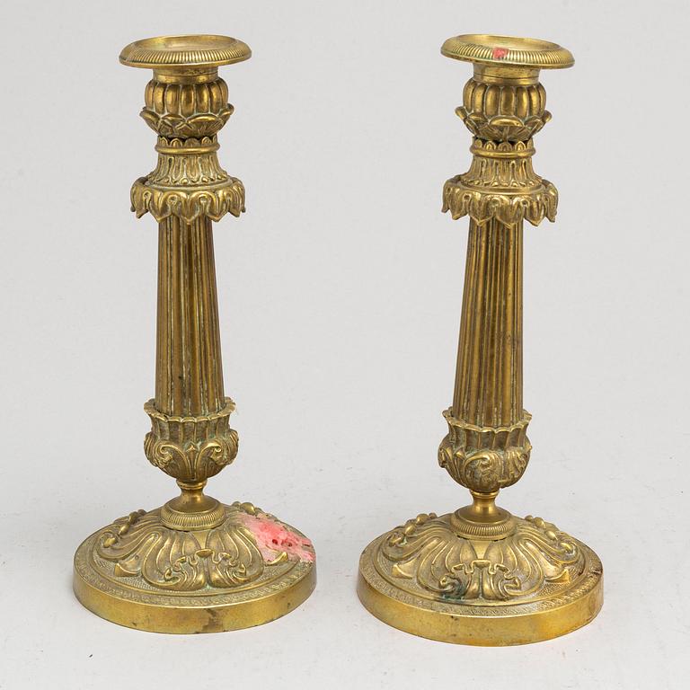 A pair of Empire bronze candlesticks, first half of the 19th century.