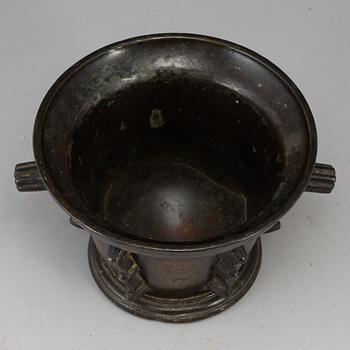 A 16th century bronze mortar.