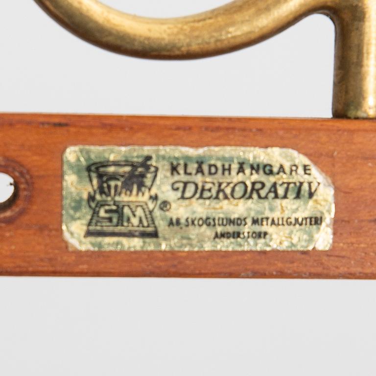 Klädhängare, "Dekorativ", Skoglunds metallgjuteri, Anderstorp, 1900-talets mitt.