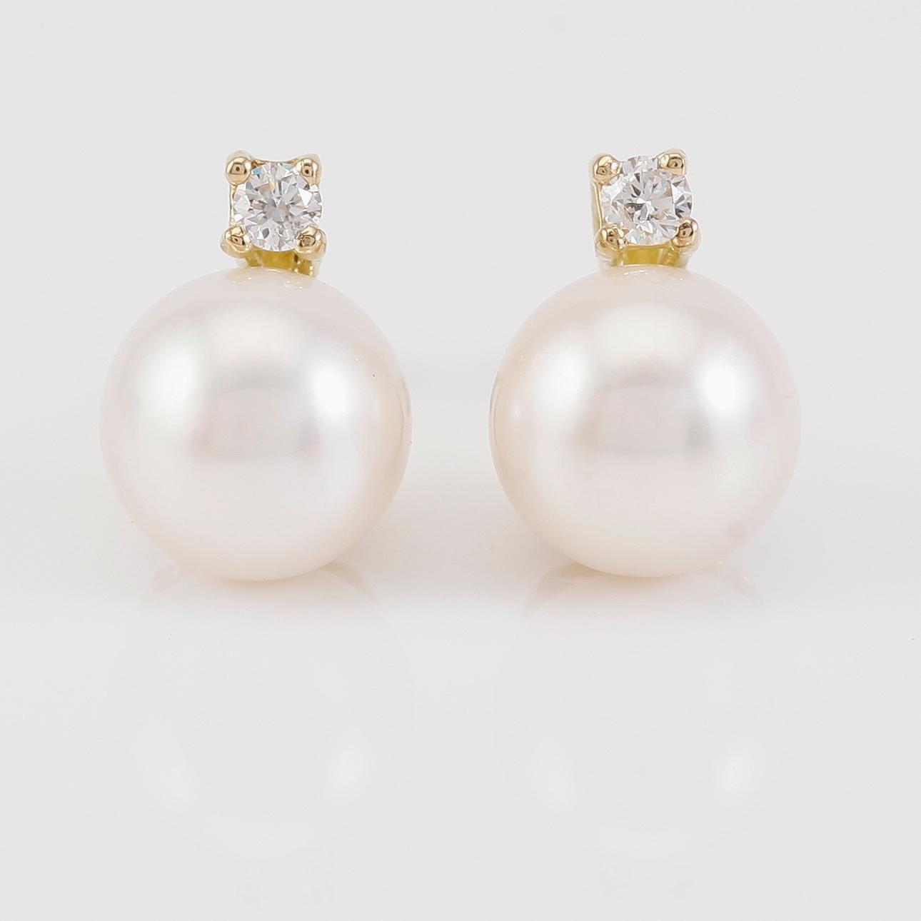 ÖRHÄNGEN, 1 par, 18K guld, diamanter tot ca 0.14 ct. och south sea pärlor.