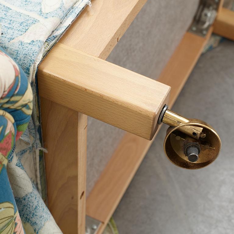 A Swedish armchair and stool, Norell Möbel, late 20th century.