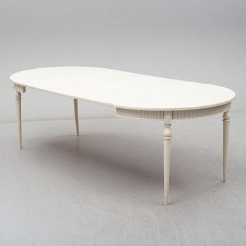 Four chairs with dinner table, late 20th Century.
