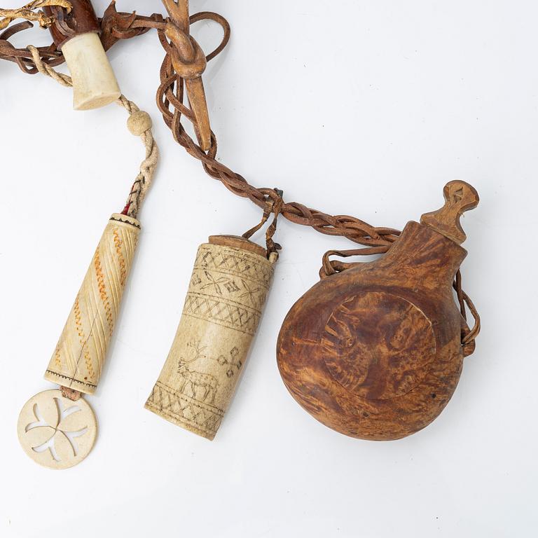 Half-horn knives, cup, bottle, needle case.