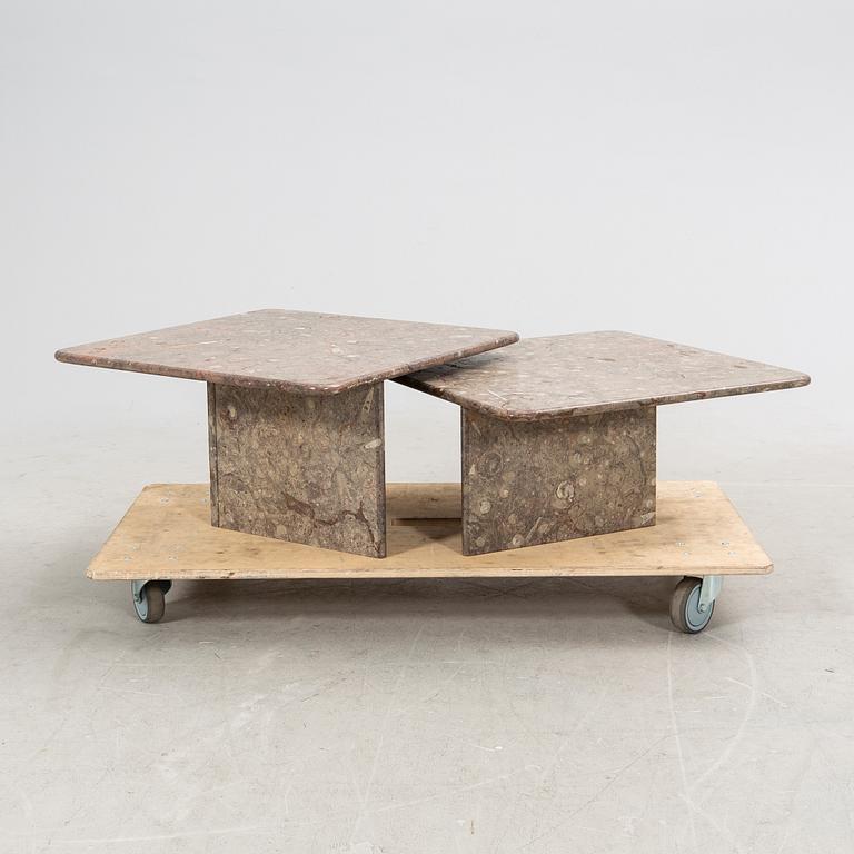 A set of two stone side tables/coffee tables.