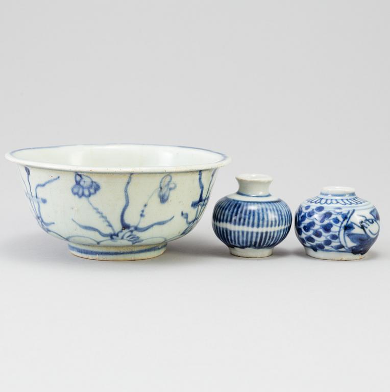 A blue and white Chinese porcelain bowl and two miniature jars for the South East Asian market, probably Ming dynasty.