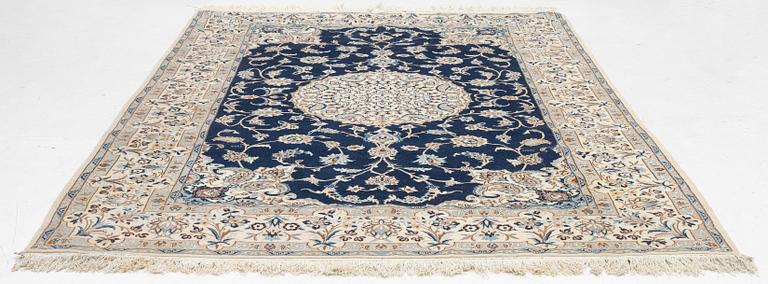 A Nain carpet, signed, c. 315 x 200 cm.