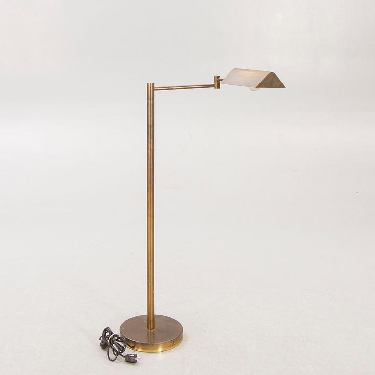 A 21st century brass floor lamp.