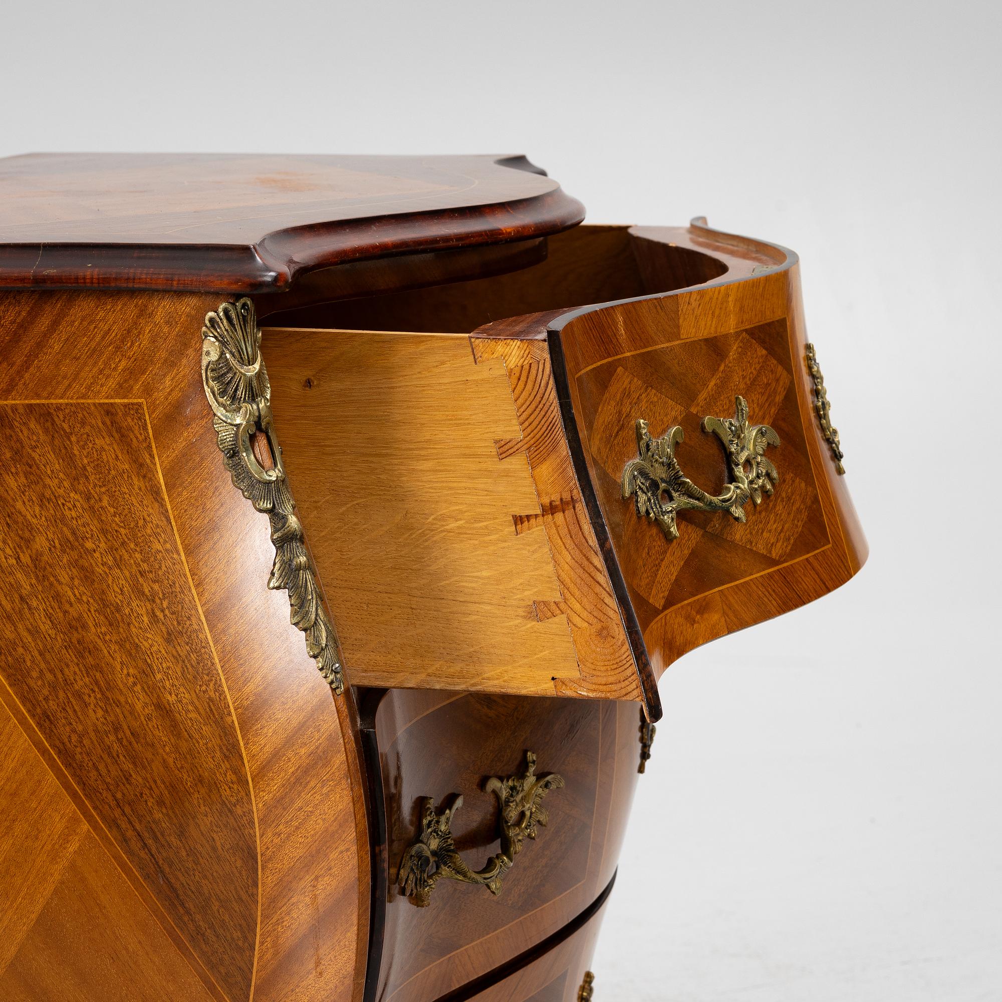 A Rococo style chest of drawers, mid-20th century.