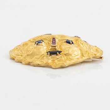 Brosch 18K guld med runda briljantslipade diamanter samt färgstenar.