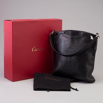 A bag "Marcello Reporter" by Cartier.