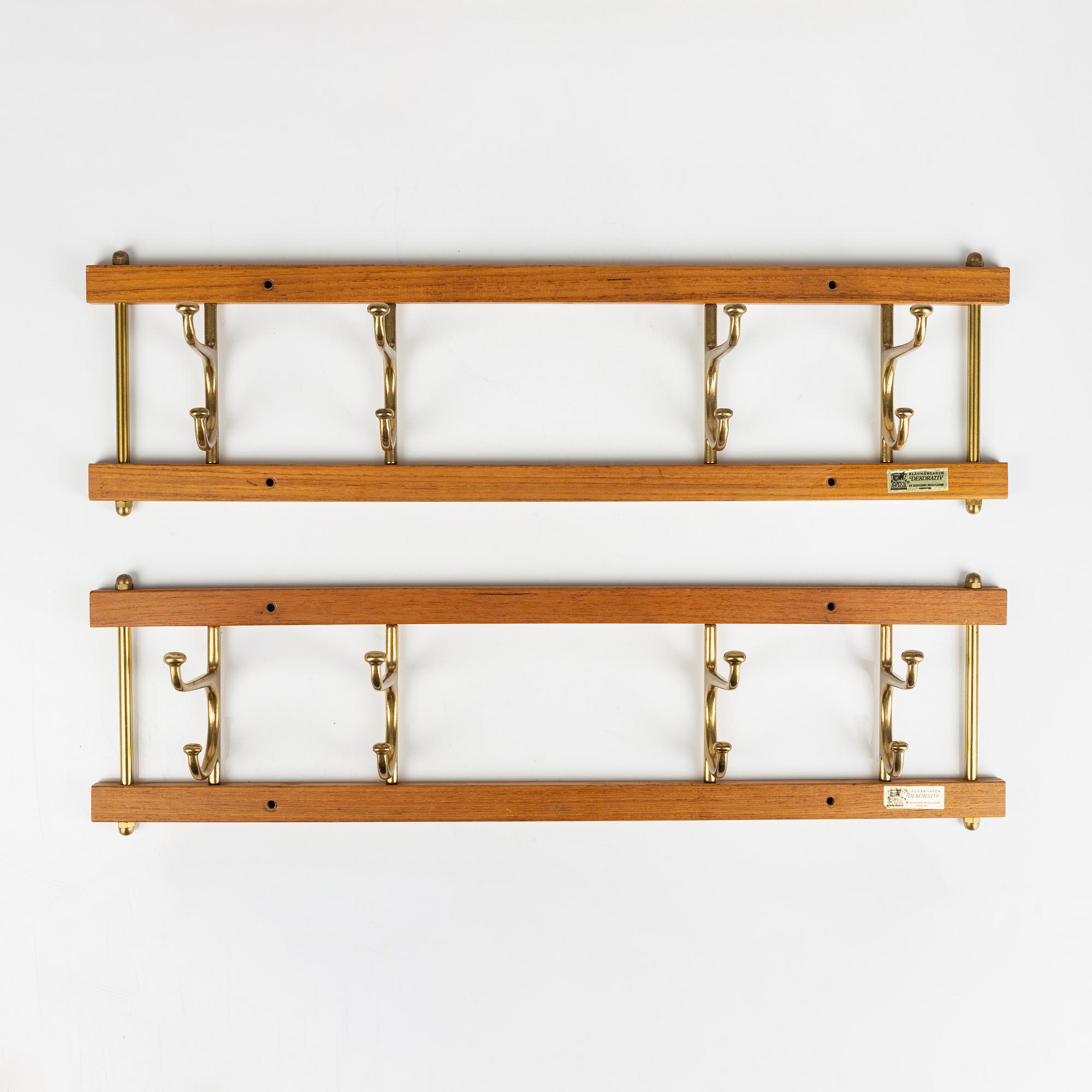 A pair of 'Dekorativ' teak coat hangers, Skoglunds metallgjuteri, Anderstorp, 1950's/60's.