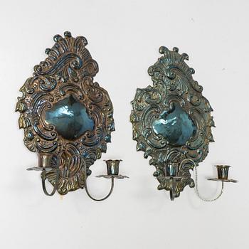A pair of Rococo-style silver-plate sconces, early 20th century.