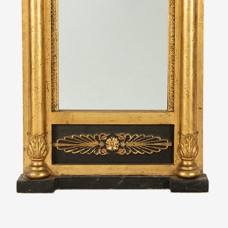 An Empire mirror, first half of the 20th Century.