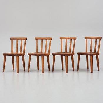 Axel Einar Hjorth, a set of four stained pine "Utö" chairs, Nordiska Kompaniet, Sweden 1930s.