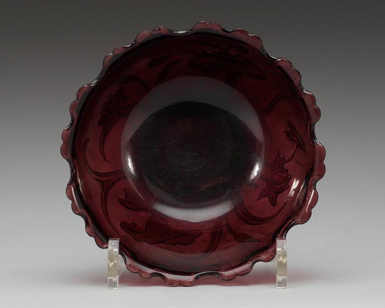 An amethyst coloured and finely cut glass bowl with lotus flowers, late Qing dynasty (1644-1912).
