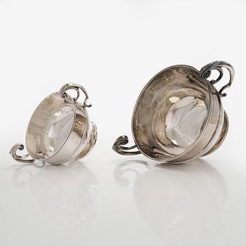 A set of two bowls with handles, sterling silver, England.