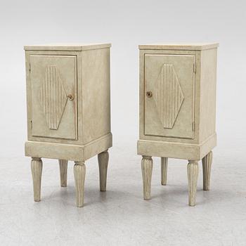 A pair of painted bedside tables. 20th Century.