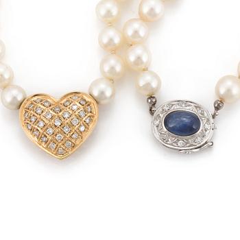 A necklace of cultured pearls with an 18K gold pendant and a clasp set with eight-cut diamonds.