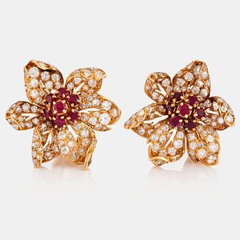 1141. A pair of 18K gold earrings Monture Boucheron set with rubies and old- and eight-cut diamonds.