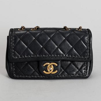 CHANEL, a black quilted fabric 'Flap Bag', 2015-2016.