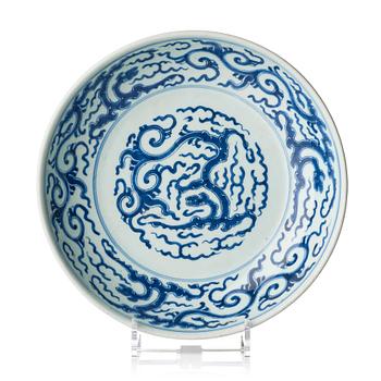 A blue and white dish with stylized dragons, 18th century.