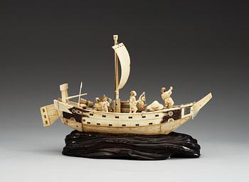 A Japanese ivory model of a ship with fishermen, Meiji period ca 1900.