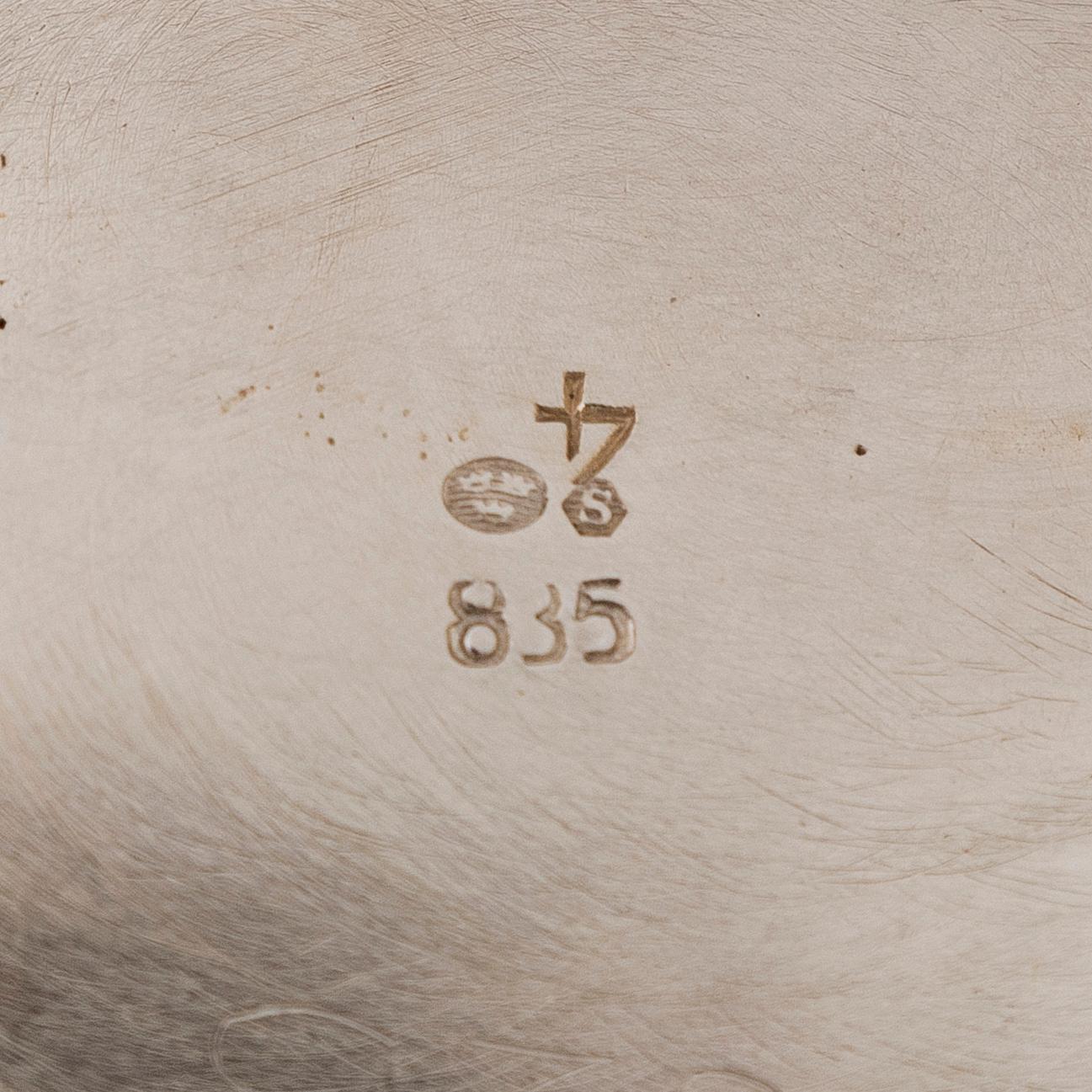 A three-piece silver coffee service, Swedish import marks. Silver sugar tongs, T.K. Alenius Vasa 1953.