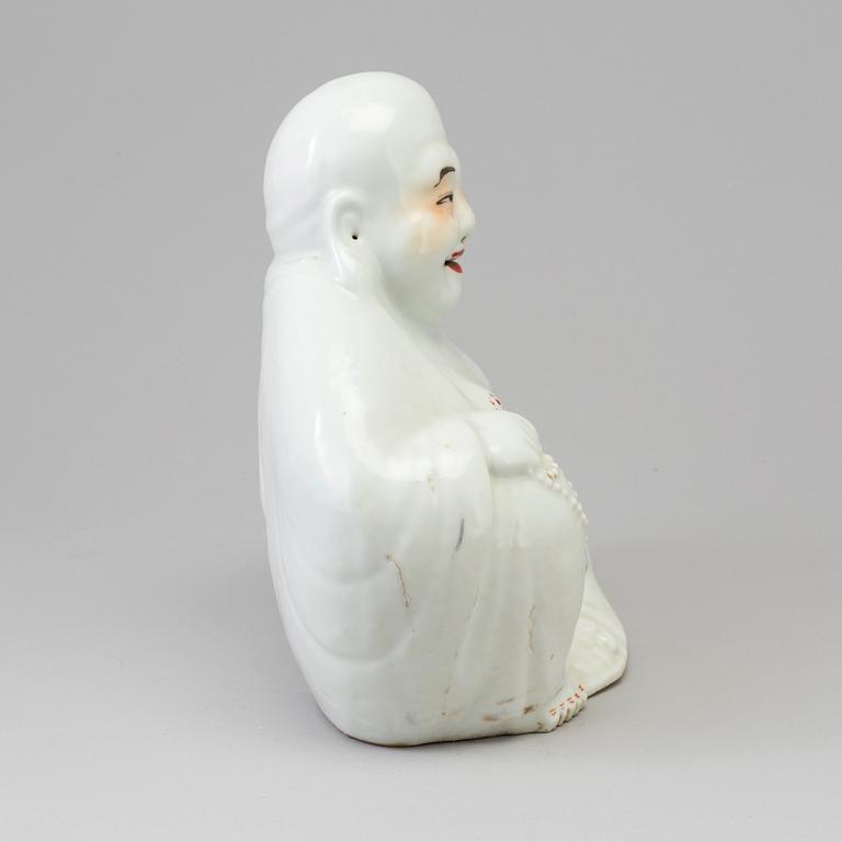 A Chinese porcelain Buddhai, 20th century.
