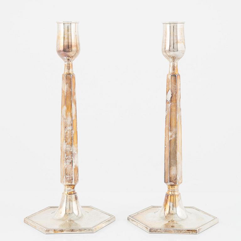 A pair of Swedish silver candlesticks, bearing the mark of K&EC, Gothenburg, 1965.