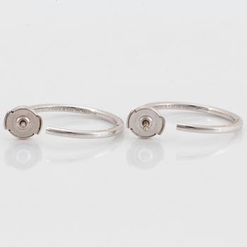 A pair of Tiffany "Metro" 18K white gold hoops set with round brilliant-cut diamonds.