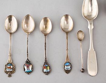 A collection of silver of 57 pcs, i.a souvenir spoons, 20th century. Total weight 1073 g.