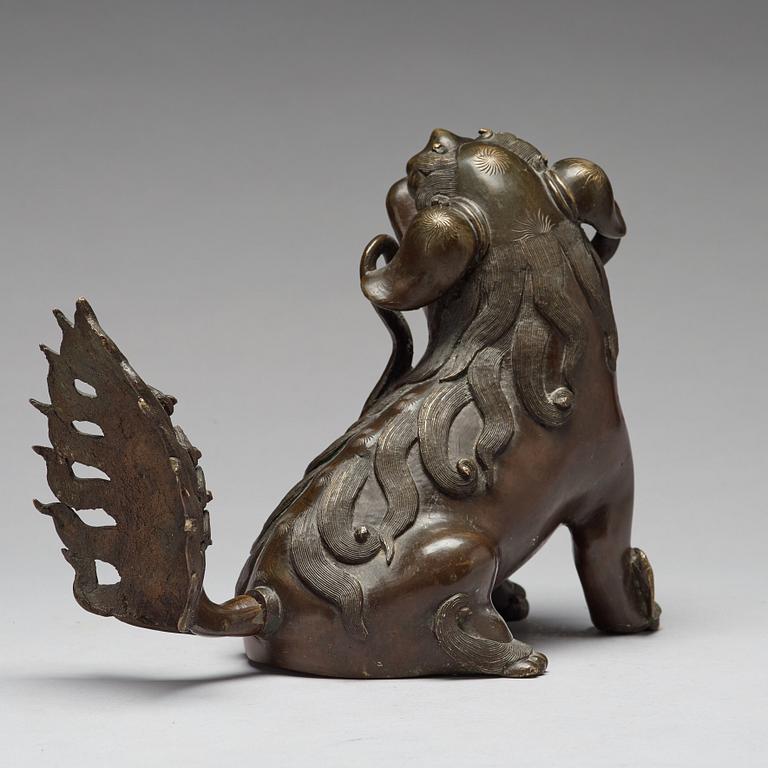 A bronze figure of a buddhist lion, Qing dynasty, 18/19th Century.