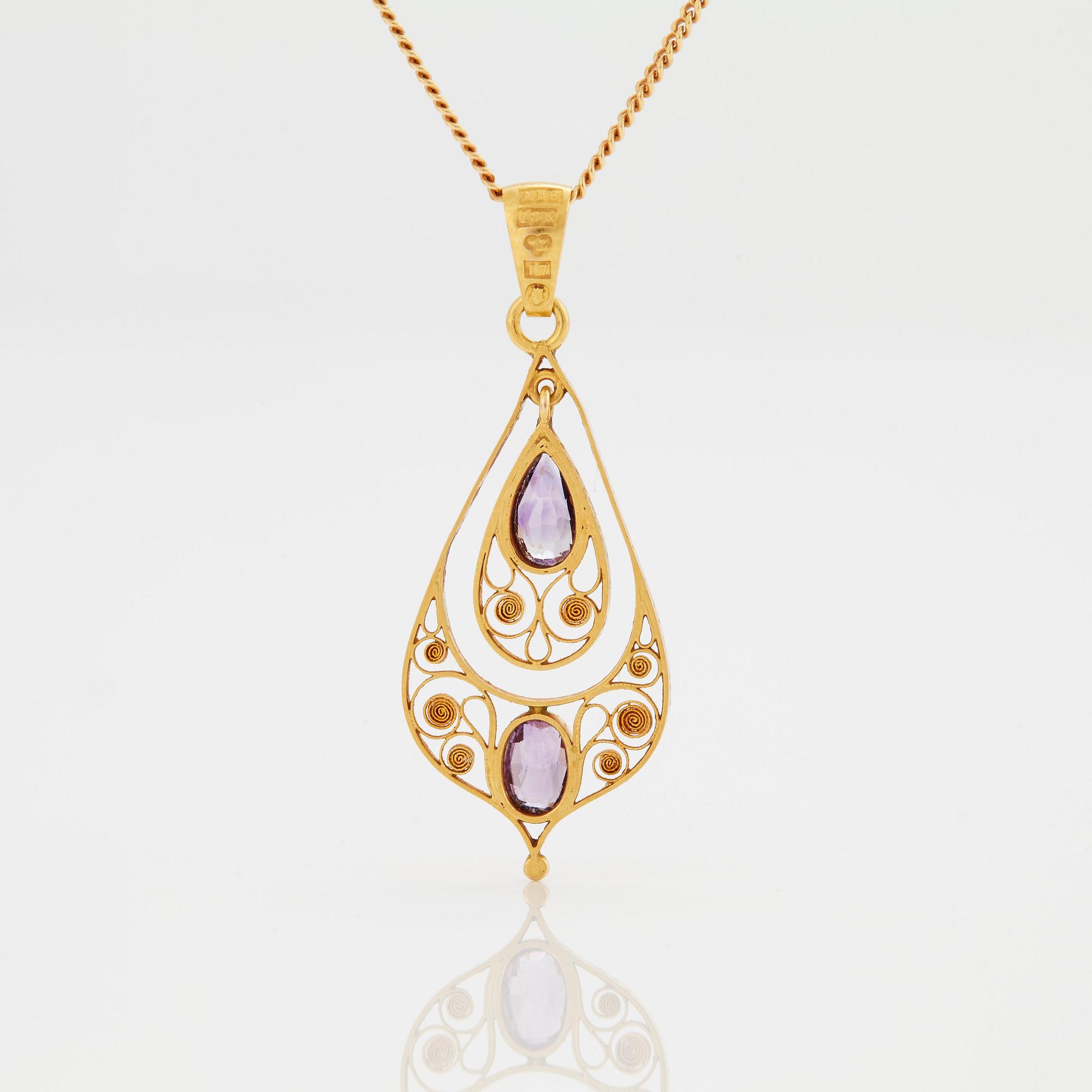 A PENDANT set with amethysts.