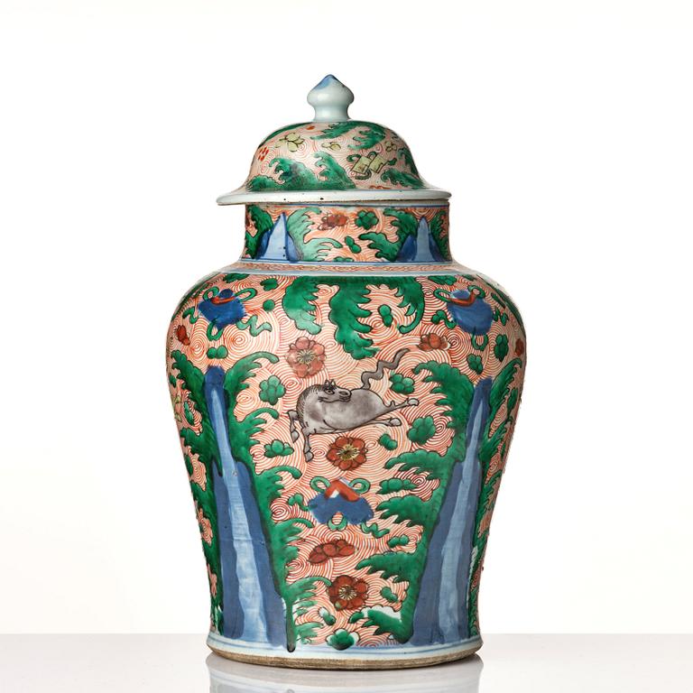 A pair of Transitional Wucai jars, 17th Century.
