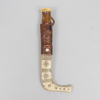 Per Erik Svonni, a reindeer horn knife, signed and dated 1928.