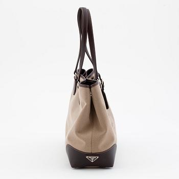 PRADA, a brown canvas and leather shoulderbag.