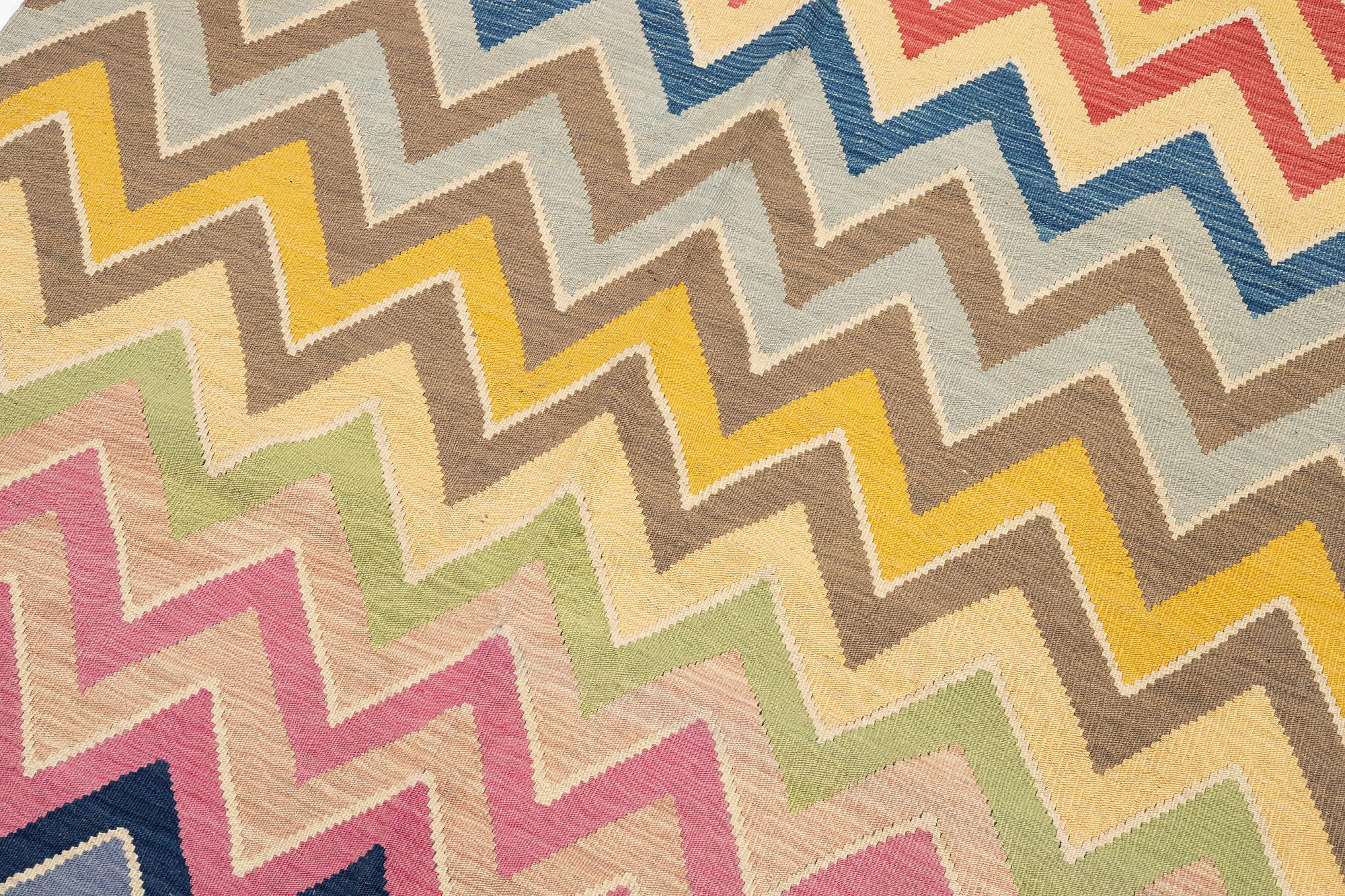 A flat-woven rug, c. 240 x 170 cm.