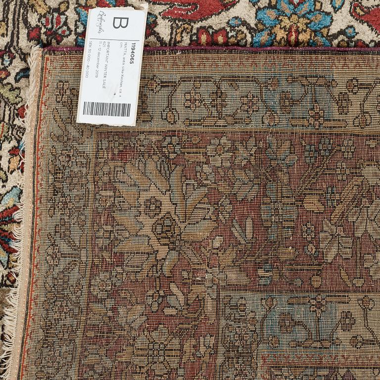 A RUG, an antique silk Kashan, possibly Motachem, ca 208-213,5 x 129,5-132 cm.