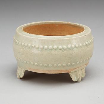 A pale celadon glazed tripod censer, Yuan dynasty (1280-1367).