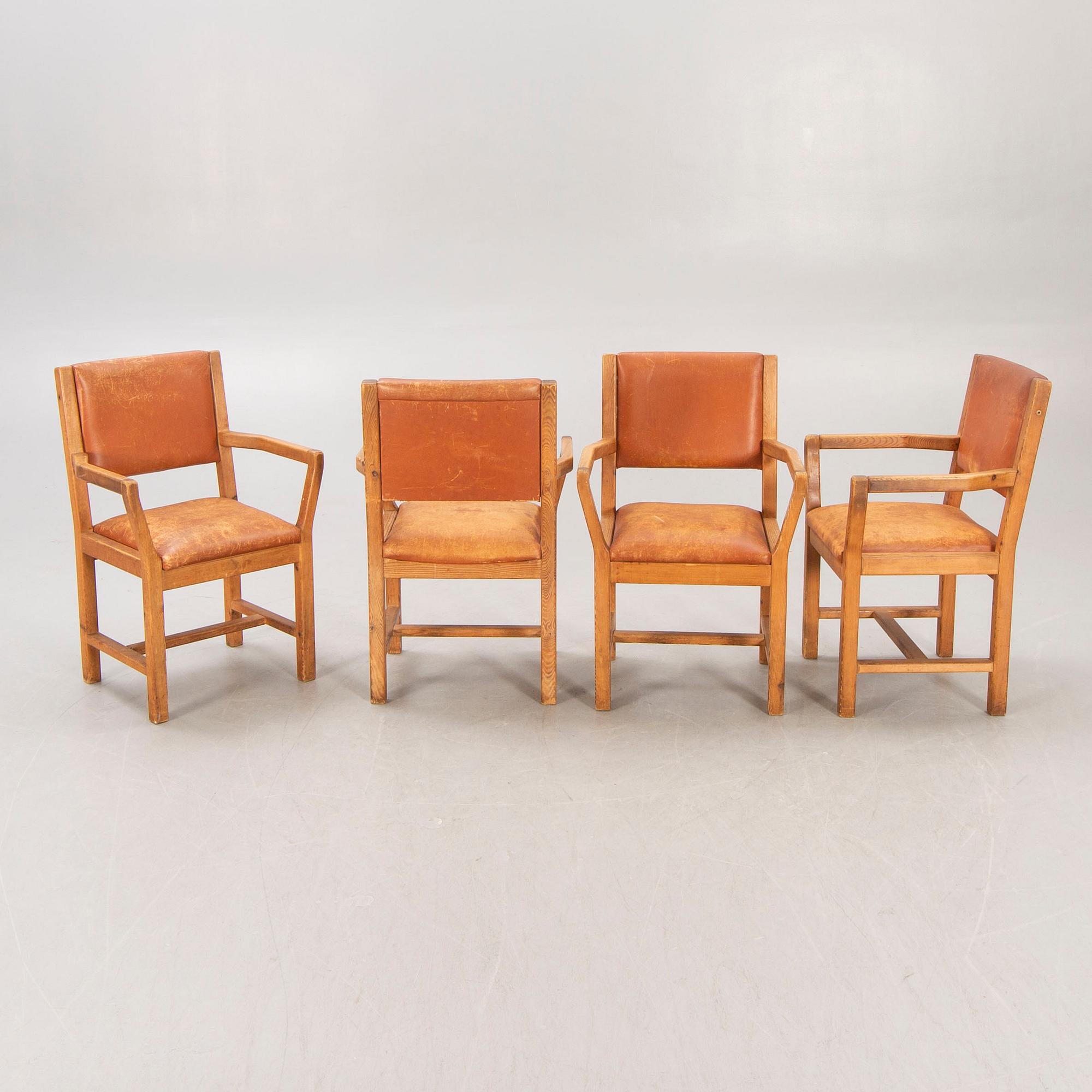 A set of four 1970:s Tage Poulsen Daumiller oak and leather armchairs for GM Möbler Denmark.