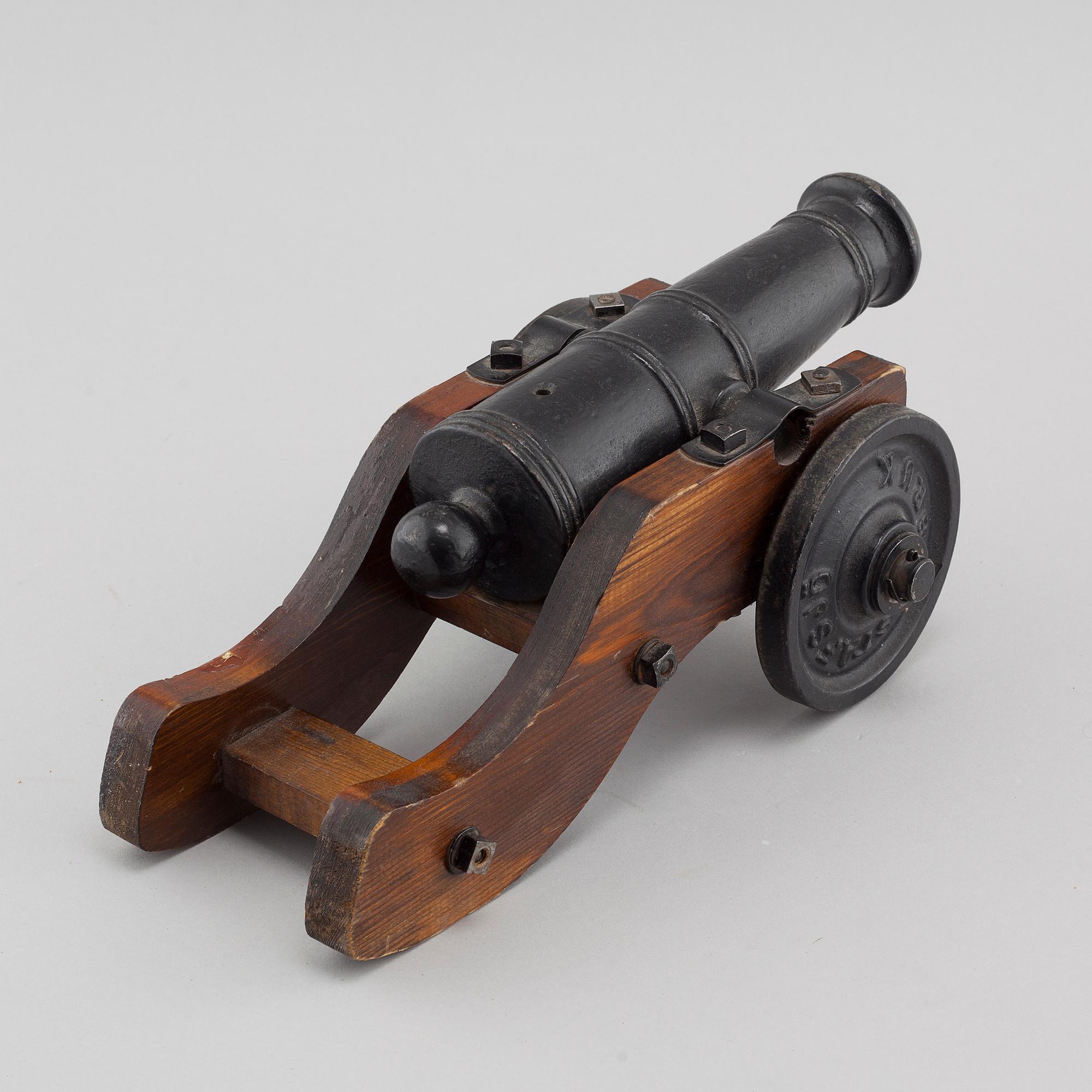 A 20th century salute cannon with wooden gun carriage by Stafsjö Bruk, Sweden.