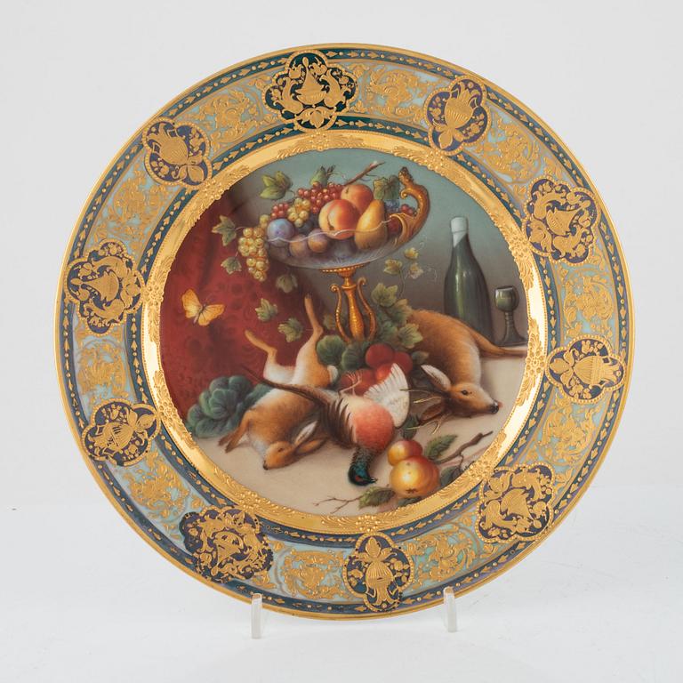 Two gilded and painted plates, around 1900.