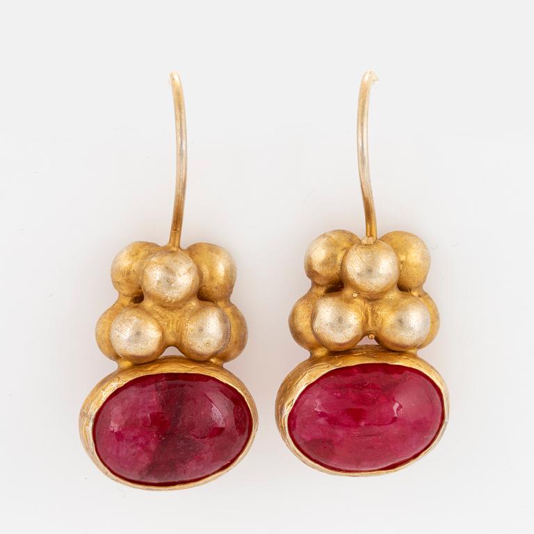 18K gold and cabochon-cut ruby earrings.