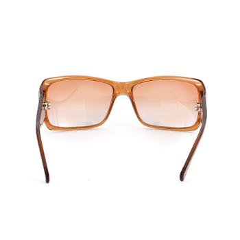 YVES SAINT LAURENT, a pair of sunglasses.