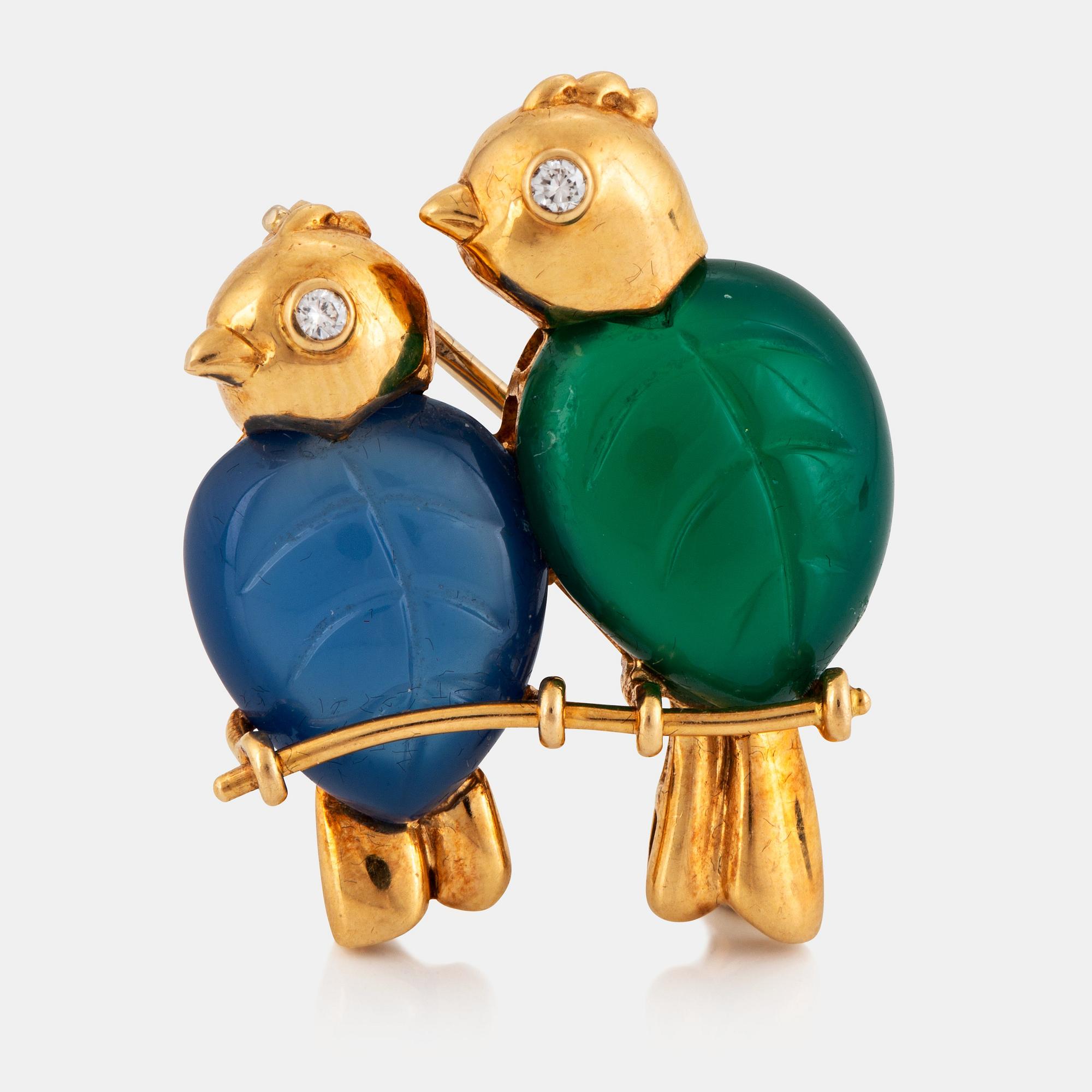 A Cartier brooch in 18K gold set with green and blue chalcedony and round brilliant-cut diamonds.