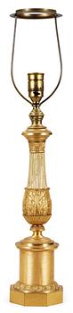704. A French Empire early 19th Century gilt bronze table lamp.