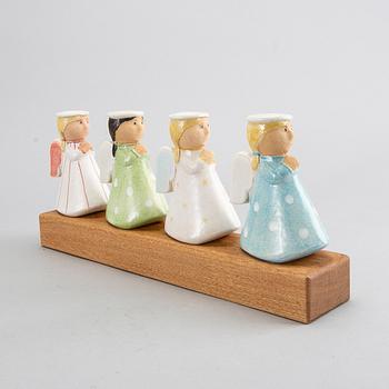 LISA LARSON, a signed candlestick.