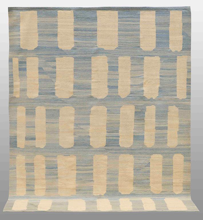 A flatweave rug, 285 x 222 cm.