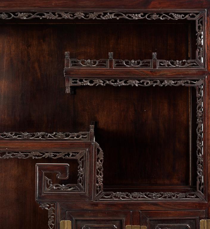 A pair of Chinese hardwood display cabinets, Qing dynasty, 19th Century.
